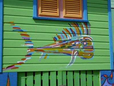 Artistic painting of multicoloured fish on colourful wooden house at Silver Sands Beach, Barbados