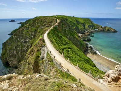 Winding walking path on a costal hill with bridge La Couplee, Sark, Bailiwick of Guernsey