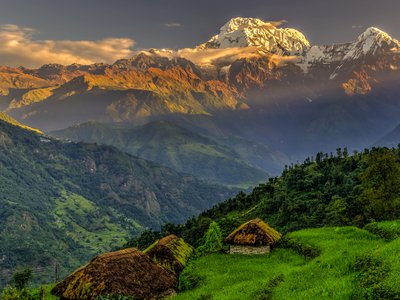 Annapurna South in the morning with soft warm sunlight glowing on mountain peak across landscape, Himalayas, Nepal