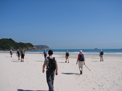 Group of people walking along beach in Hong Kong