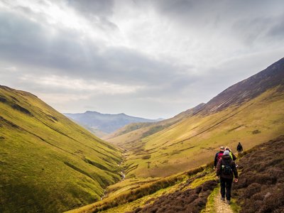 Line of walkers following pathway near Scafell Pike, Lake District
