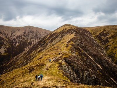 Walking group hiking up Causey Pike - North Western Fell, Newlands Valley, Lake District