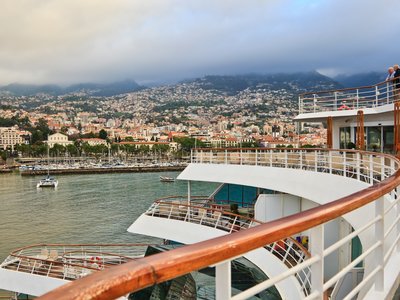 People standing on cruise ship decking, Madeira, Portugal