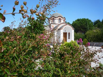White church behind bushes in Stagira Akanthos, Greece