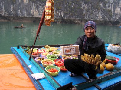 Floating marfket and seller, Halong Bay, Vietnam