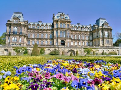 Durham Castle with colourful flowers in the foreground