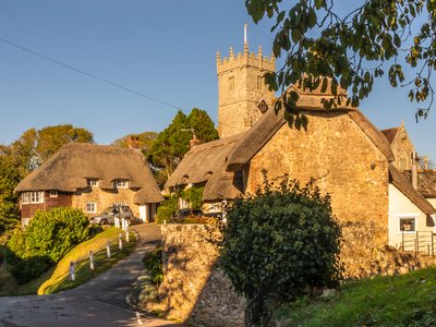 Church and thatch cottages of Godshill, Isle of Wight, England, UK