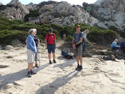 Ramble Worldwide walking group taking break while out on walking trail in Sardinia