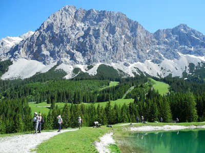 Hikers admiring landscape, Ehrwalder Almsee, Austria