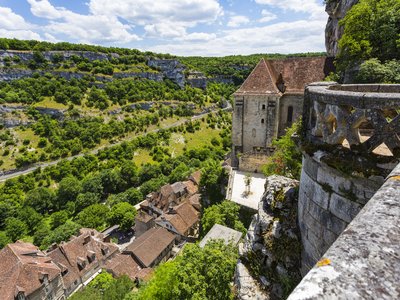 View from stone balcony of traditional French stone houses in green landscape, Rocamadour, Gramat, Gourdon, Lot, Midi-Pyrenees, France