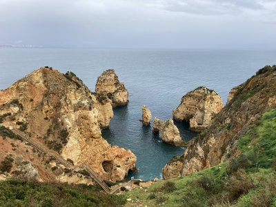 Stairway leading down to coastal edge by sea, Western Algarve, Portugal