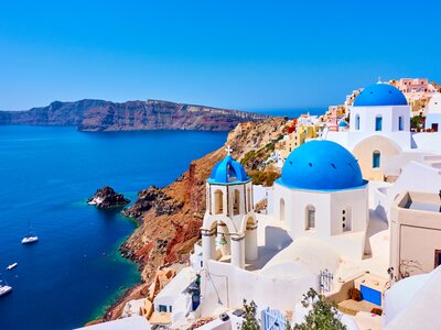 Blue-roofed buildings on coast, Santorini, Greece