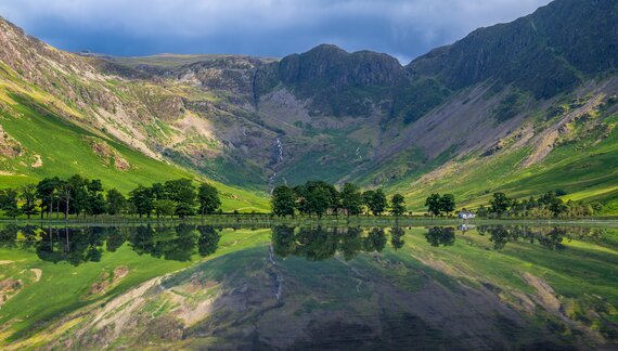 Panoramic Landscape shot of Buttermere lake and Lake District Peaks with reflection