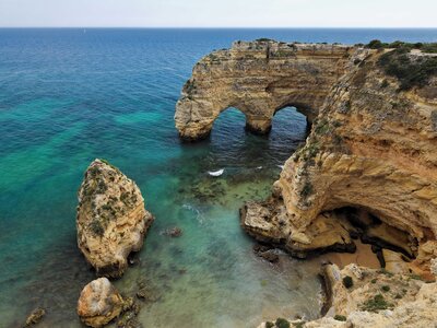 Cliff face and rock formations with turquoise waters, Western coast of Algarve, Portugal