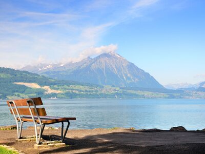 Bench view of lake Thun and Niesen mountain, Bernese Oberland, Switzerland