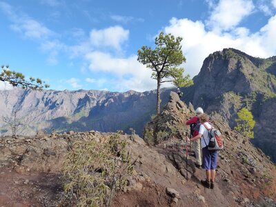 Hikers admiring mountain range view in La Palma, Spain