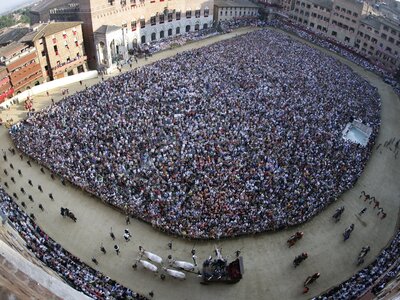 Panoramic aerial view of "Piazza del Campo" during the Palio of Siena festival in Siena, Italy