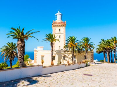 Palm trees and Lighthouse of Cap Spartel, near Tangier and Gibraltar, Morocco, Africa