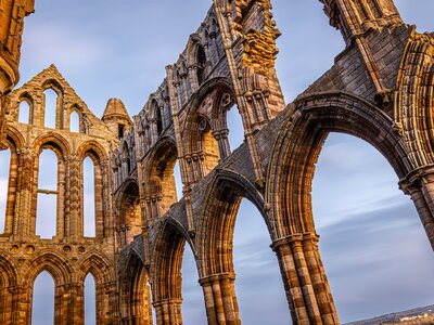 Sunset view of Whitby abbey overlooking the North Sea on the East Cliff above Whitby in North Yorkshire, England, UK
