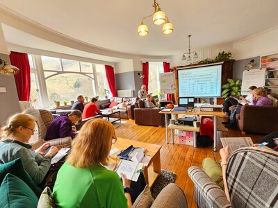 Ramble Worldwide group learning about timing on navigation skills course at Hassness Country House, Lake District, Cumbria