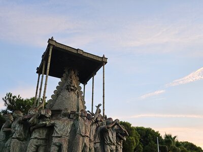 Monument a la Virgen del Rocío with soft sunrise glow casted over the statue, Spain