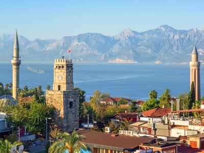 Antalya Kaleici Old Town with the Clock Tower, Yivli Minaret, Tekeli Mehmet Pasa mosque, Mediterranean Sea and the Taurus Mountains in background, Turkey