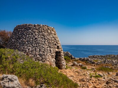 Old stone trullo that leads from ciolo bridge to Cipolliane caves, Italy