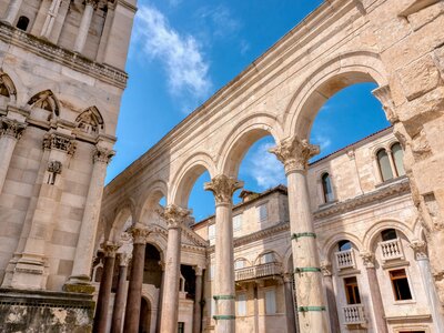 The landmark ancient Roman columns and arches of the central courtyard, called the Peristyle, in Diocletian's Palace, located in the Old Town of Split, Croatia
