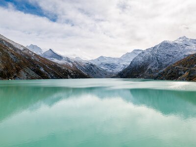 Mattmark reservoir in autumn with fresh snow, Saas valley, Switzerland