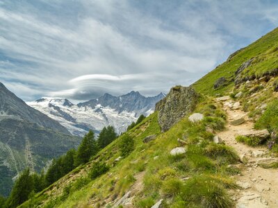 Walking trail from Kreuzboden to Saas-Almagell with incredible views of Alps above the Saas-Fee village in southern Switzerland