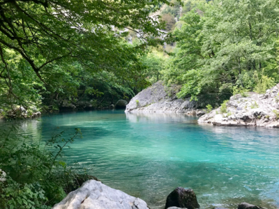 Turquoise waters of Voidomatis River in Greece