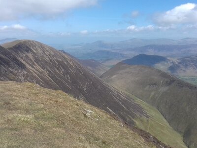Mountainous landscape on cloudy and sunny day with Wandope Fell, in north-western area of the English Lake District