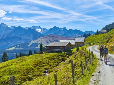 Beautiful alpine panorama with a hiking group, in Austria