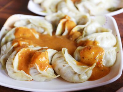 Nepali traditional snack, Chicken MoMo serve with spicy and sour sauce