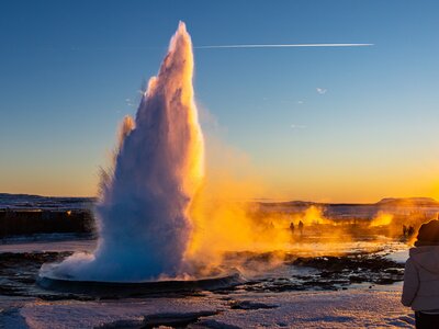 Exploding geyser at sunset, Iceland