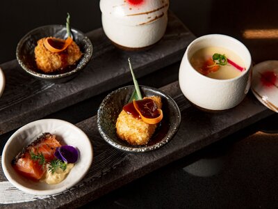 Kaiseki sushi platter combo set on the serving board in the fine dining Japanese restaurant, sashimi, nigiri and raw fish