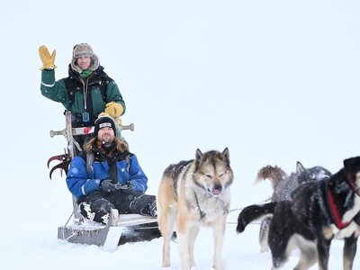 Dog sledding in Svalbard on an expedition