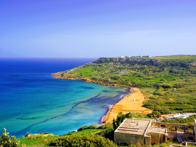 Red sand beach and coastal landscape from high view, Ramla Bay, Gozo, Malta
