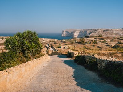 Panoramic scenic sunrise viewpoint over high Sanap Cliffs at Sannat and azure Mediterranean Sea on a sunny day, Gozo Island, Malta, Europe