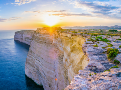 Sunset view over Ta Cenc cliffs on Gozo, Malta