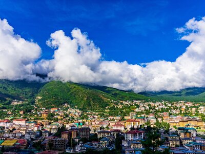 Magnificent view of Thimphu City of Bhutan with green mountains and clouds in the background