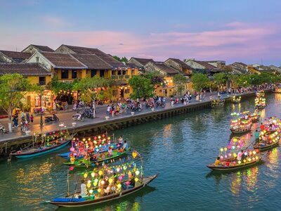 Ancient town Hoi An with colourful boats on river, Vietnam