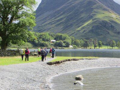 Group of women walking alongside Buttermere Lake in the Lake District, Women's Activity Week