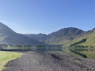 Calm lake in the Lake District during ramble worldwide holiday women's activity week