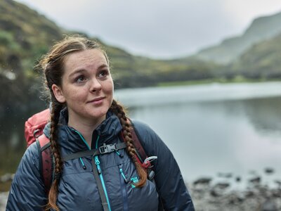 Woman in outdoor clothing in the countryside