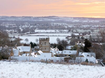 Cotswold village and landscape in snow at sunrise, Bourton-on-the-Hill, Cotswolds, Gloucestershire, England, United Kingdom, Europe