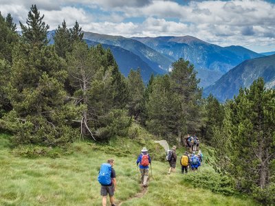 Group of people trekking through Vall del Riu, Andorra, Europe