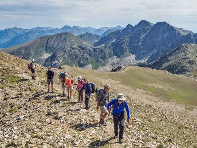 Ramble Worldwide walking group hiking along mountainside towards Pic Negre d'Envalira, Andorra
