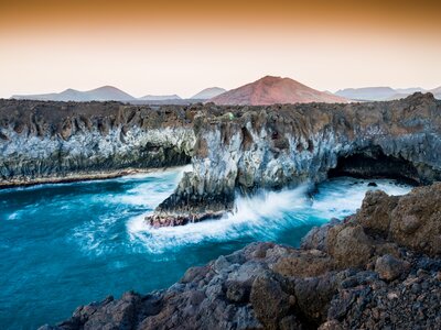 Waves crashing up against coastal rock in Lanzarote, Spain