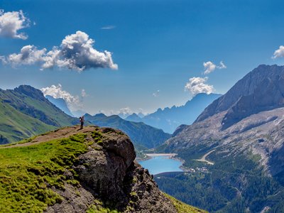 Lone walker looking out over the Dolomite mountains, Italy